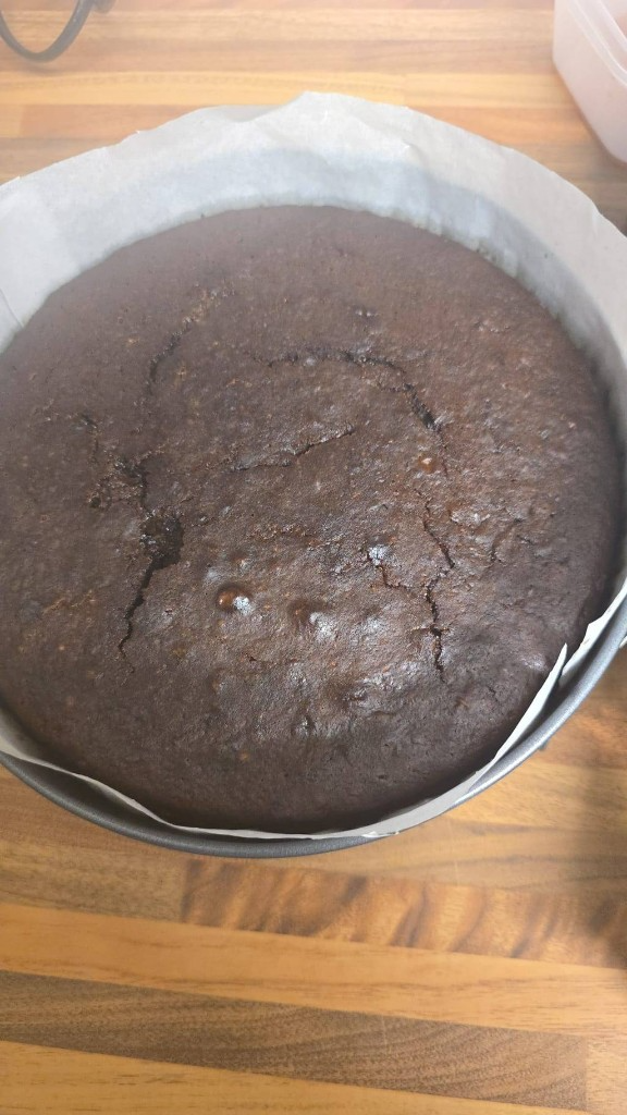Freshly baked round chocolate cake